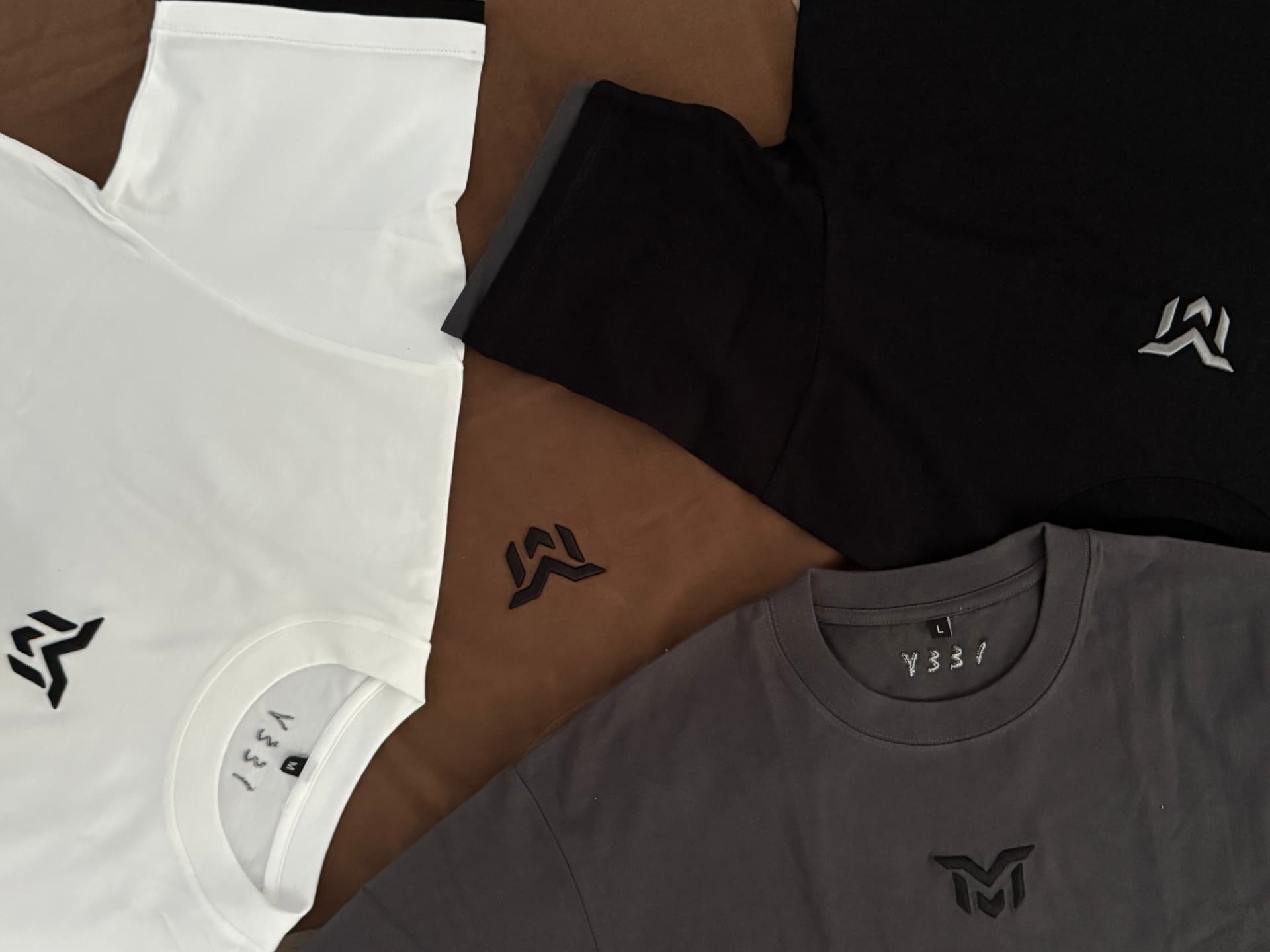 Munasir tees with embroidered logo