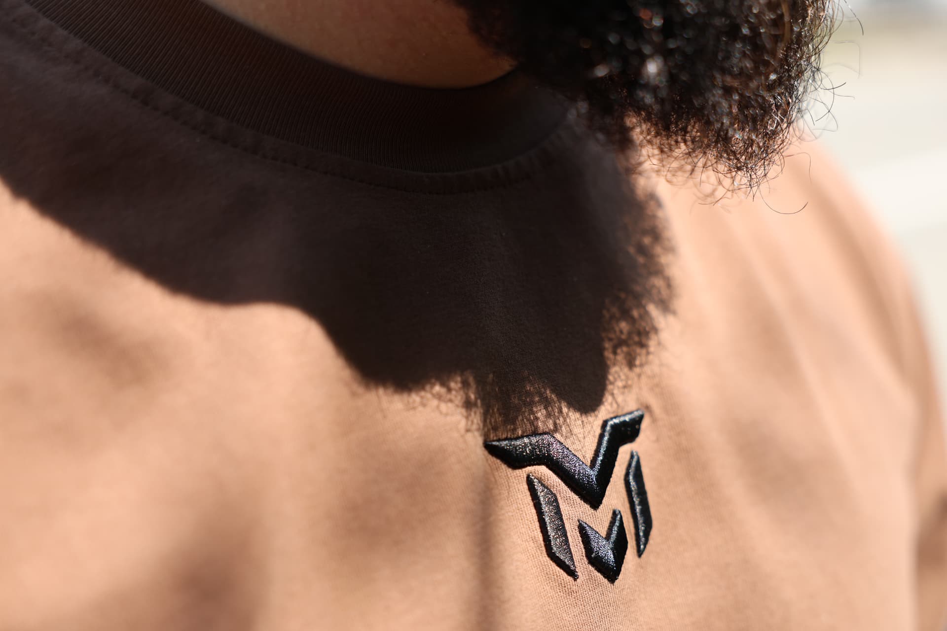 Munasir tees with embroidered logo