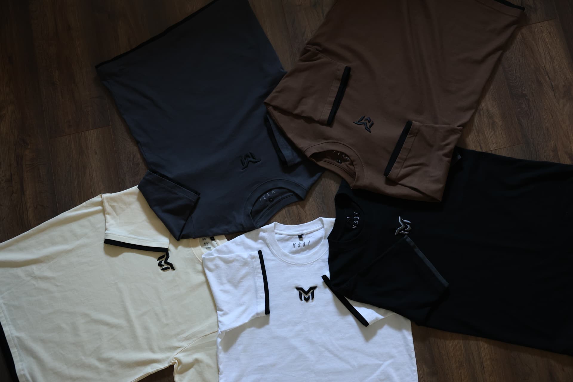 Munasir tees with embroidered logo
